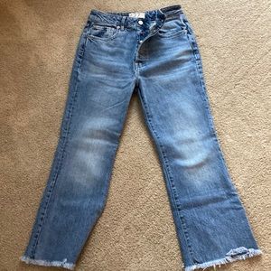 We The Free high waist size 27 crop flare jeans with raw edge.